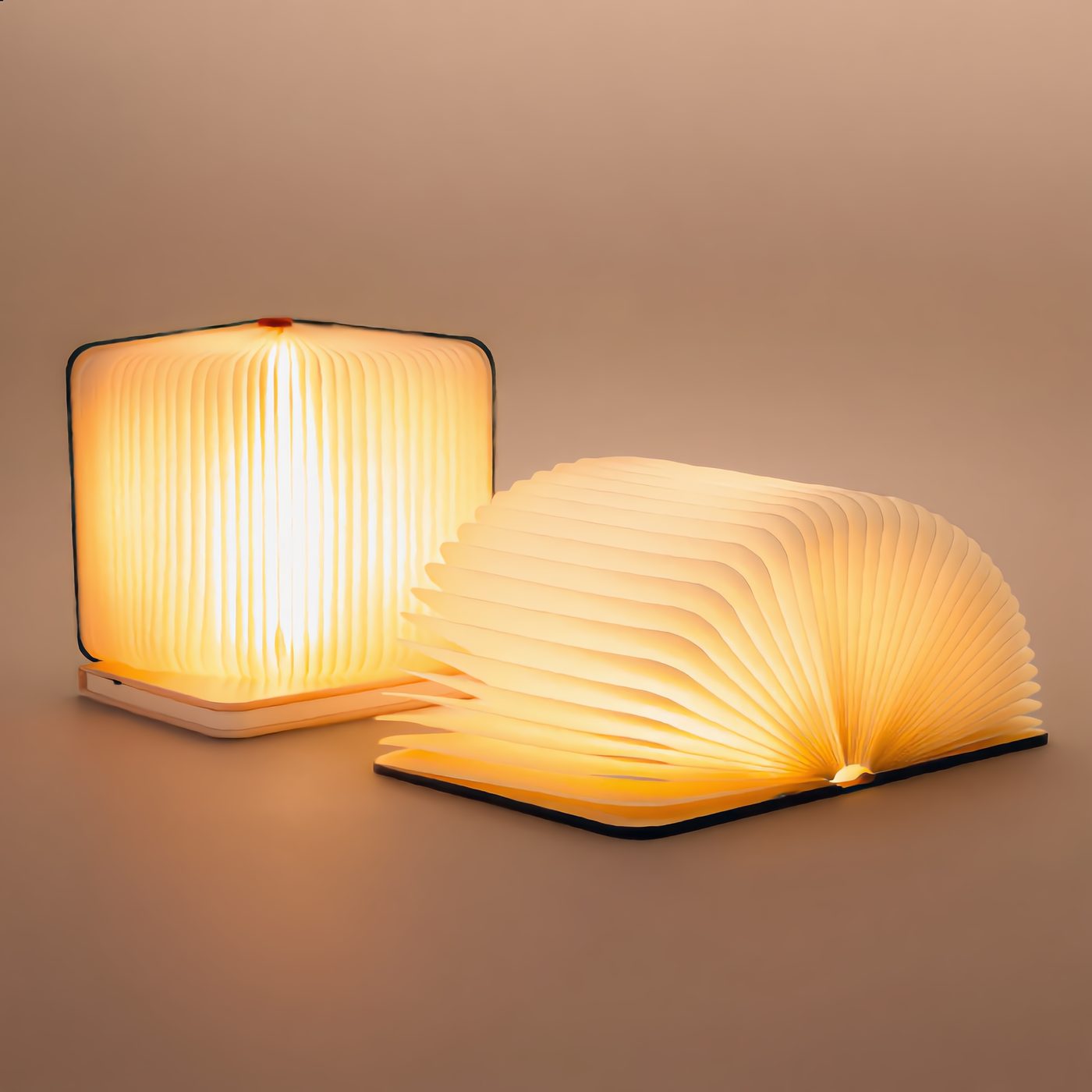 Folding Book Lamp glowing, standing upright and fanned open
